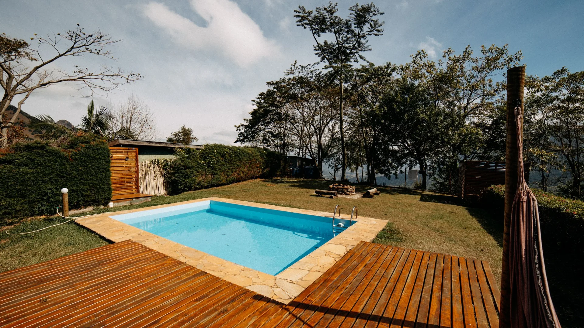 Backyard pool with a wood deck
