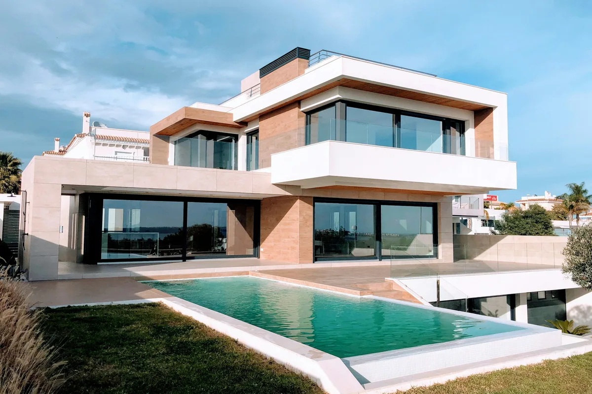 Modern home with a fenced pool terrace